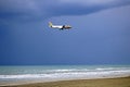 Plane of Gulf Air over McKenzie beach before landing at Larnaca International Airport, Cyprus Royalty Free Stock Photo