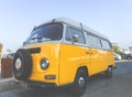 Larnaca, Greece - July 19, 2016: Classic yellow Volkswagen Transporter camper van parked on a street at Middleton beachfront. Royalty Free Stock Photo