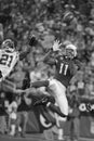 Larry Fitzgerald goes for the leaping catch.