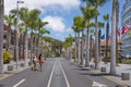 Two women passing through deserted resort of Playa de las Americas, Tenerife, Canary Islands, Spain