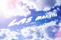 Las marietas. Text from clouds in sky in bright sunlight. Royalty Free Stock Photo