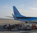 Las Palmas de Gran Canaria, Canary Islands, Spain December 26, 2020: Unloading luggage from Tui airline plane to baggage