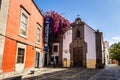 Las Palmas, Spain - Feb 22, 2023: Small pedestrian cobblestone street in Vegueta. Las Palmas, Gran Canaria, Spain