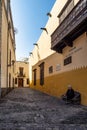 Las Palmas, Spain - Feb 22, 2023: Small pedestrian cobblestone street in Vegueta. Las Palmas, Gran Canaria, Spain