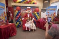 Las Pinas, Metro Manila, Philippines - A Jollibee mascot poses with the birthday celebrant and her mom Royalty Free Stock Photo