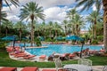 Las Vegas, Nevada - Outdoor tropical pool area at the JW Marriott hotel and resort, with poolside lounge chairs , Royalty Free Stock Photo