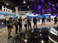 Customers gathered around a colorful Royole tree advertising flexible displays at CES