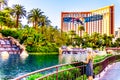 The Lake and Waterfalls at The Mirage Resort and Casino on Las Vegas Boulevard. The Treasure Island Resort in the background