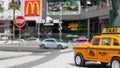 LAS VEGAS, NEVADA USA - 7 MAR 2020: Yellow vacant mini taxi cab close up on Harmon avenue corner. Small retro car model. Little