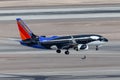 Southwest Airlines Boeing 737 aircraft painted in a special SeaWorld Shamu the whale livery on approach to land