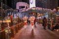 LAS VEGAS - November 11, 2020, a girl`s feather stands on a night street illuminated by multi-colored lights, Las Vegas is the