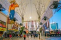 Las Vegas, NV, USA, June 15, 2018: Tourists outside the Pioneer Cowboy Vegas Vic neon sign watch the Freemont Street