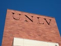 UNLV Logo on side of Red Brick building