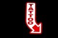 Las Vegas style Neon Tattoo Sign Royalty Free Stock Photo