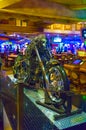 Las Vegas, United States of America - May 7, 2016: The silver motorcycle and tables for card game in the Fremont Casino