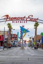 Fremont East district entrance sign with neon sculptures in early morning light