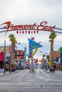 Fremont East district entrance sign with neon sculptures in early morning light