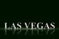 Las Vegas, words from different card suits, on a black background.Reflection. Poker. Gambling