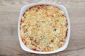 Lasagna baking in ovenproof dish with cheese Royalty Free Stock Photo