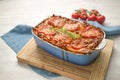 Lasagna, fresh from the oven, casserole dish of flat pasta sheets, ground beef sauce, vegetables and tomatoes, topped with melted Royalty Free Stock Photo