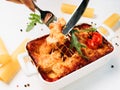 Lasagna portion white background italian food Royalty Free Stock Photo