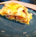 Italian lasagna with pumpkin on a plate, close-up.