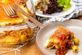 Lasagna on wooden table Royalty Free Stock Photo