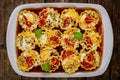 lasagne roll ups in white oven tray with tomato sauce Royalty Free Stock Photo