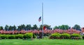 A Lasalle County cemetary is fully adorned in preparation for a Memorial Day ceremony.  The flag is at half staff Royalty Free Stock Photo
