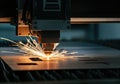 Laser cutting machine creating sparks while processing metal sheet Royalty Free Stock Photo