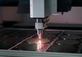 Laser cutting machine processing silicon wafers in a cleanroom environment