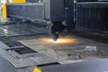 Laser cutting. Metal machining with sparks on CNC laser engraving maching Royalty Free Stock Photo