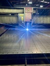 Laser cutting. Metal machining with sparks on CNC laser engraving maching. Royalty Free Stock Photo