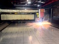 laser cutting. Metal machining with sparks on CNC maching Royalty Free Stock Photo