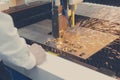 Laser cutting of metal sheet with sparks Royalty Free Stock Photo