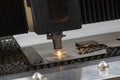 Laser cutting of metal sheet with sparks Royalty Free Stock Photo