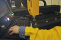 Laser cutting and the operator at the control panel Royalty Free Stock Photo
