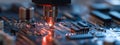 Close-up of laser engraving process on a printed circuit board in a workshop setting Royalty Free Stock Photo