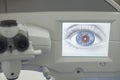 Laser eye surgery. Close-up workplace of an ophthalmologist surgeon, monitor with a graphic image of the eye, microskim for Royalty Free Stock Photo
