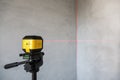 The laser level shows the verticality of the wall