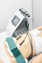 Laser lipo equipment. Cosmetic fat reduce treatment. Woman in medicine salon. Anti cellulite procedure Royalty Free Stock Photo