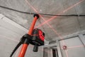 Laser measurement during renovation. Construction tools and equipment. Red laser light lines for level measure. Royalty Free Stock Photo