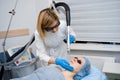 Laser photorejuvenation and carbon peeling of face for woman. Black face mask. Dermatology and cosmetology. Using