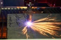 Laser or plasma cutting metalworking with sparks Royalty Free Stock Photo