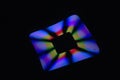 Laser radiating rainbow curved rectangle on black