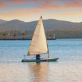 Laser sailing boat on water at sunset.  Montenegro,  Kotor Bay Royalty Free Stock Photo