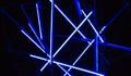 Laser show, night club interior lights, glowing lines, abstract fluorescent background Royalty Free Stock Photo