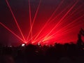 Laser show nightlife club stage with party people crowd. entertainment with audience silhouettes in nightclub event Royalty Free Stock Photo