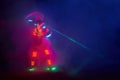 Laser show performance, dancers in led suits with LED lamp, very beautiful night club performance, party Royalty Free Stock Photo