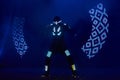 Laser show performance, dancers in led suits with LED lamp, very beautiful night club performance, party Royalty Free Stock Photo